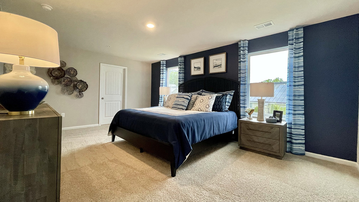 Hanover primary bedroom with two windows on either side of bed.