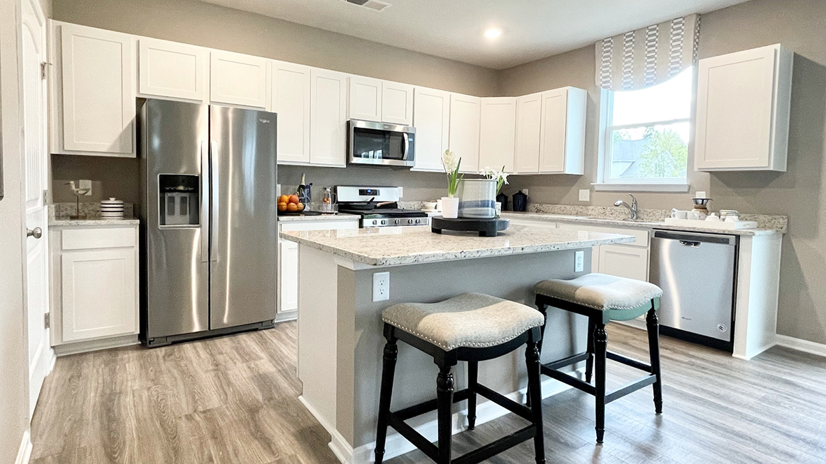 The spacious kitchen boasts a large island with room for seating.