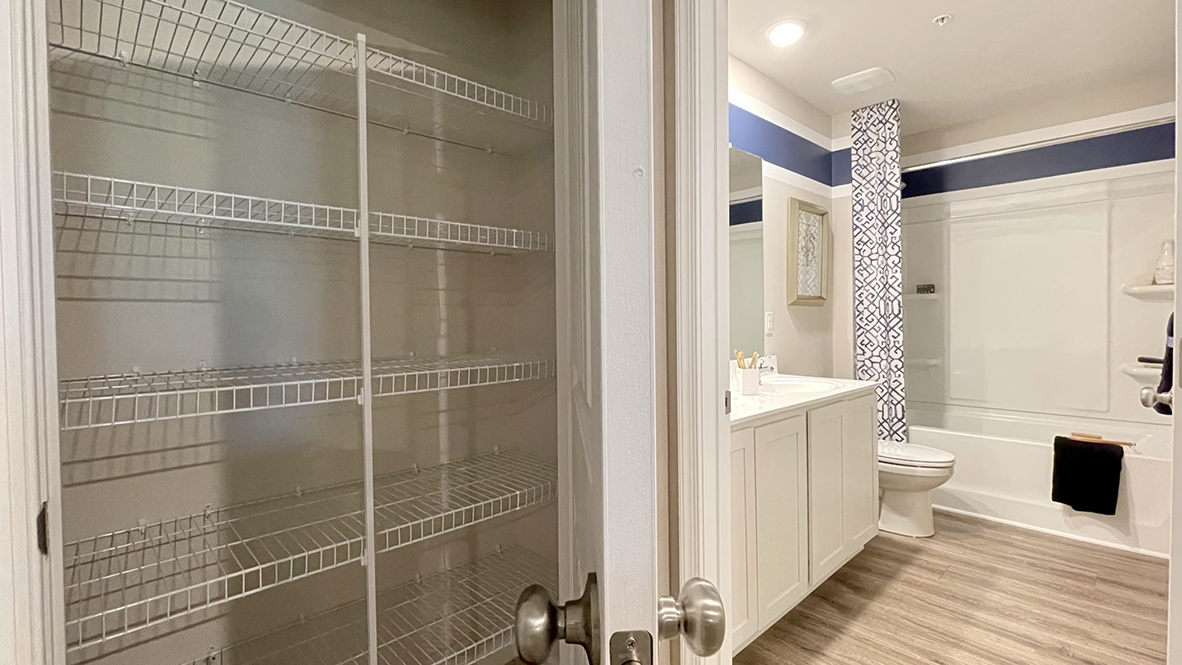 The guest bathroom has a tub shower.