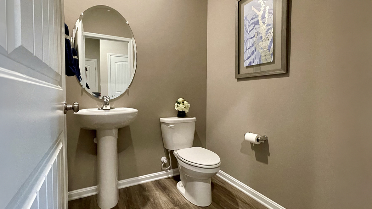 The powder room is conveniently located on the first floor.