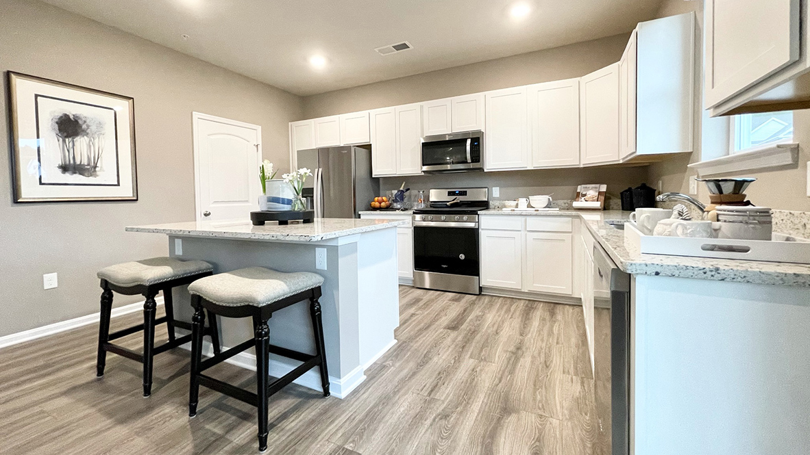 The kitchen has an eat-in dining space that flows perfectly into the sizeable family room.