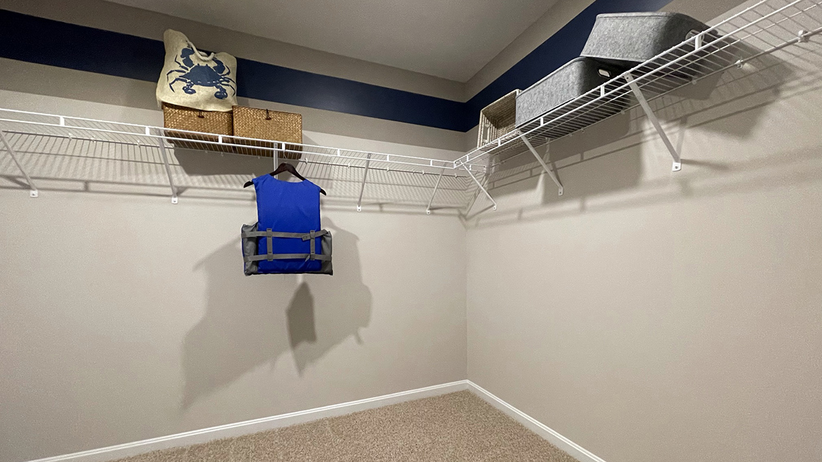 Upstairs, the owner’s suite boasts a generous walk-in closet.