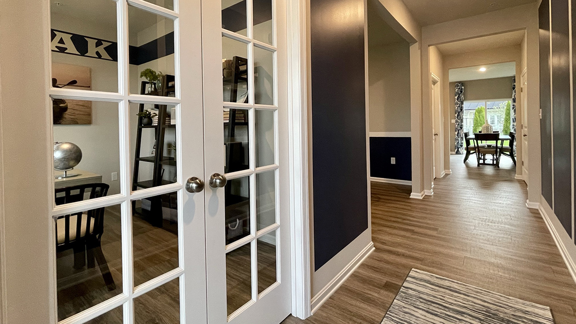 As you step into the distinct foyer you will appreciate an additional room that provides the perfect space for a home office.
