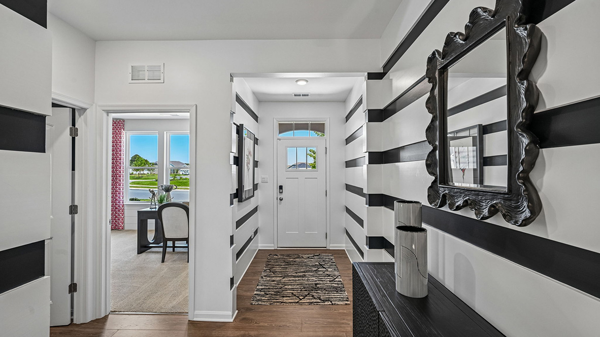 The welcoming foyer separates to afford privacy to the two spacious guest bedrooms.