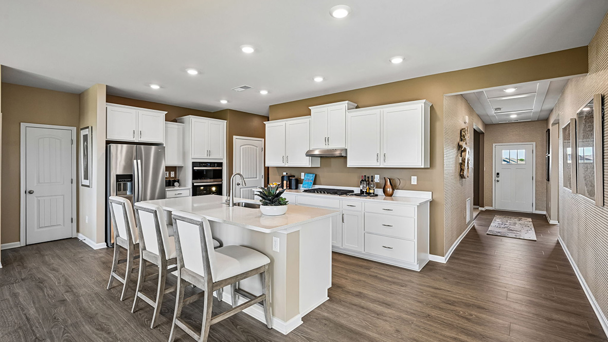 The home's well-designed kitchen features an oversized island with room for seating.