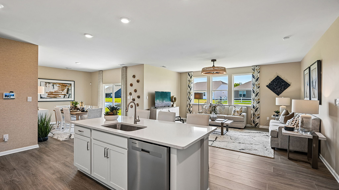 The home's well-designed kitchen features upgraded countertops
