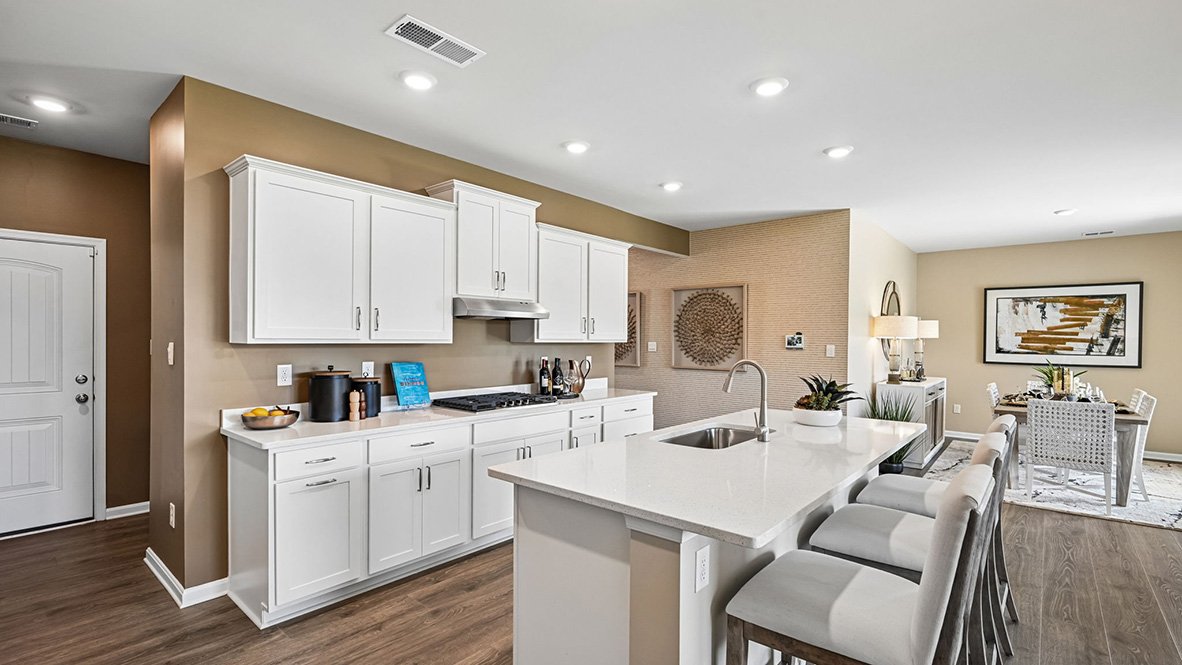 The home's well-designed kitchen features an oversized island.