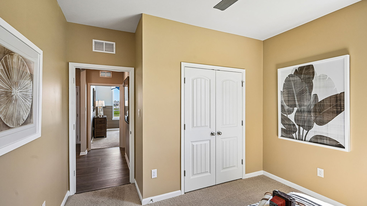Two guest bedrooms are at the entrance of the home.