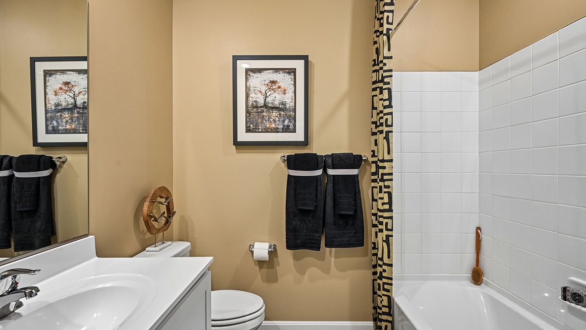 A shared guest bathroom is at the front of the home.