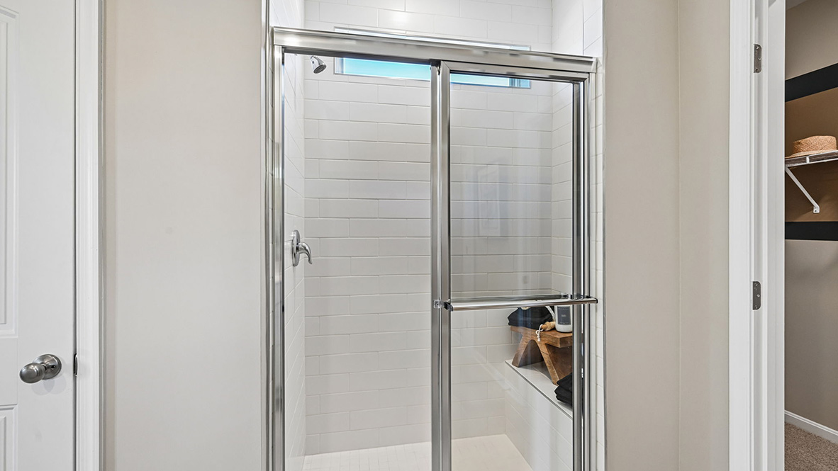 The private bathroom has a walk-in shower.