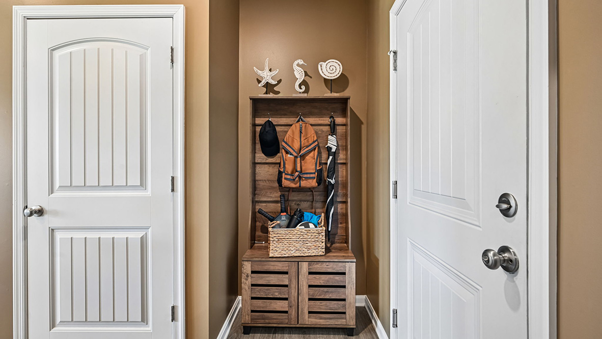 The laundry room and coat closet are located off the two-car garage.