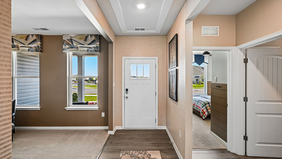 A welcoming foyer leads you to the inviting flex room with an abundance of natural light.