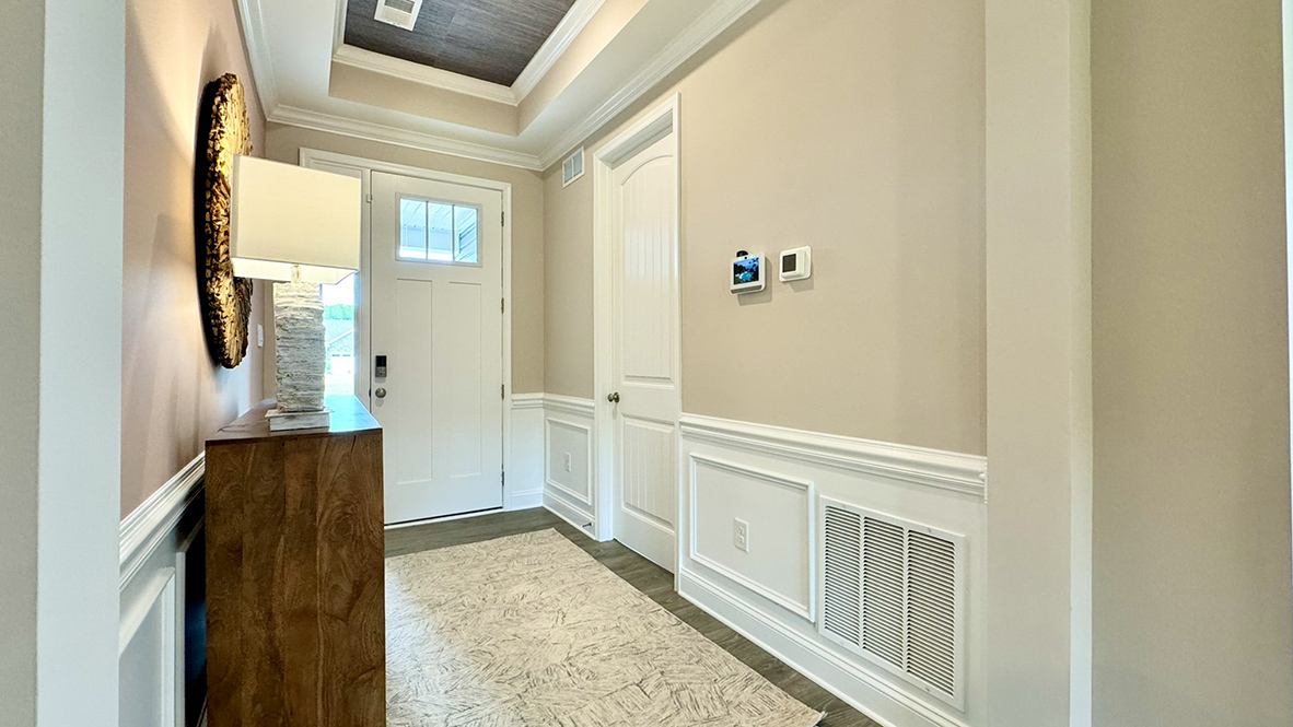 Large hallway entrance with upgraded wood trim.