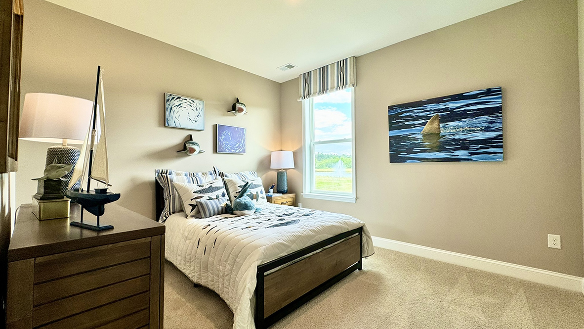 Secondary bedroom with window.