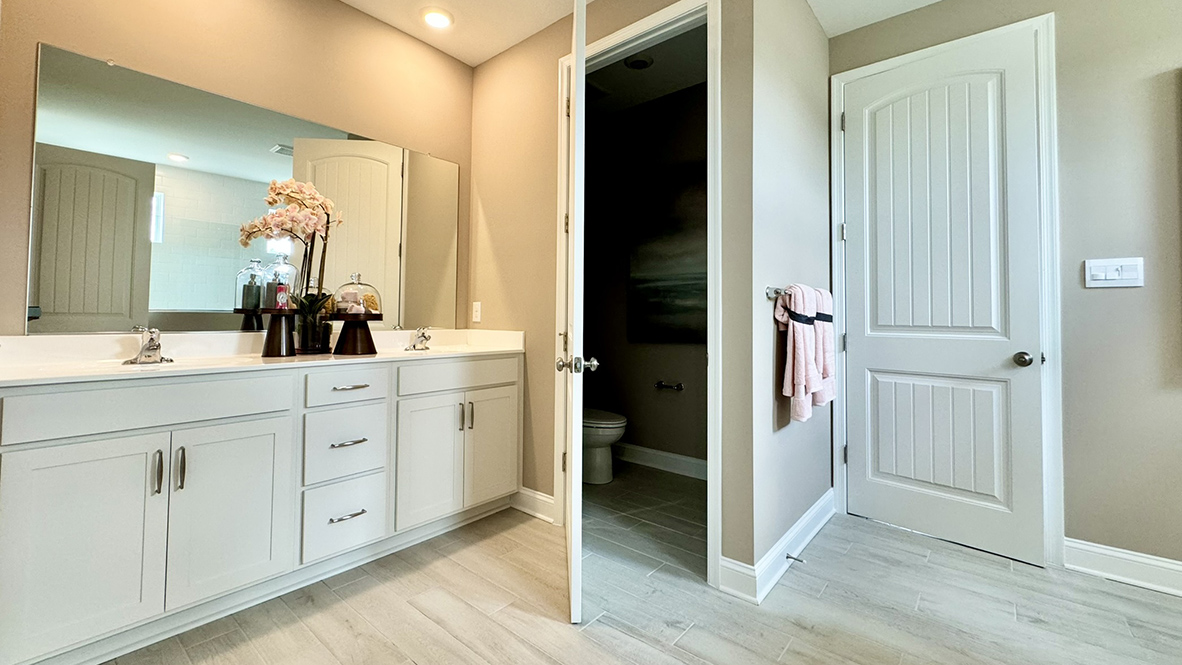 The owner’s suite includes a toilet closet and a double bowl vanity.