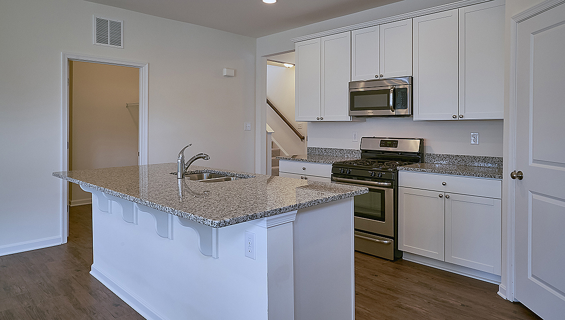 The well-designed kitchen boasts plenty of cabinets