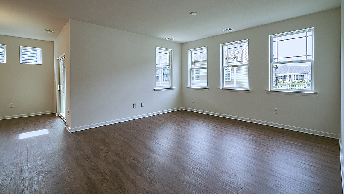 The open kitchen boasts a large island which opens into the large living area.