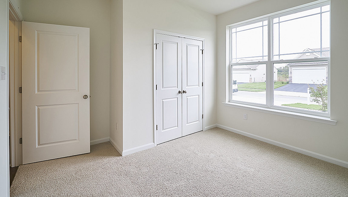 The guest bedrooms and the secondary bathroom are located near the front of the home.
