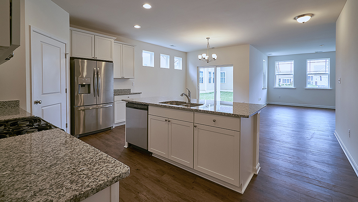 The open kitchen boasts a large island.