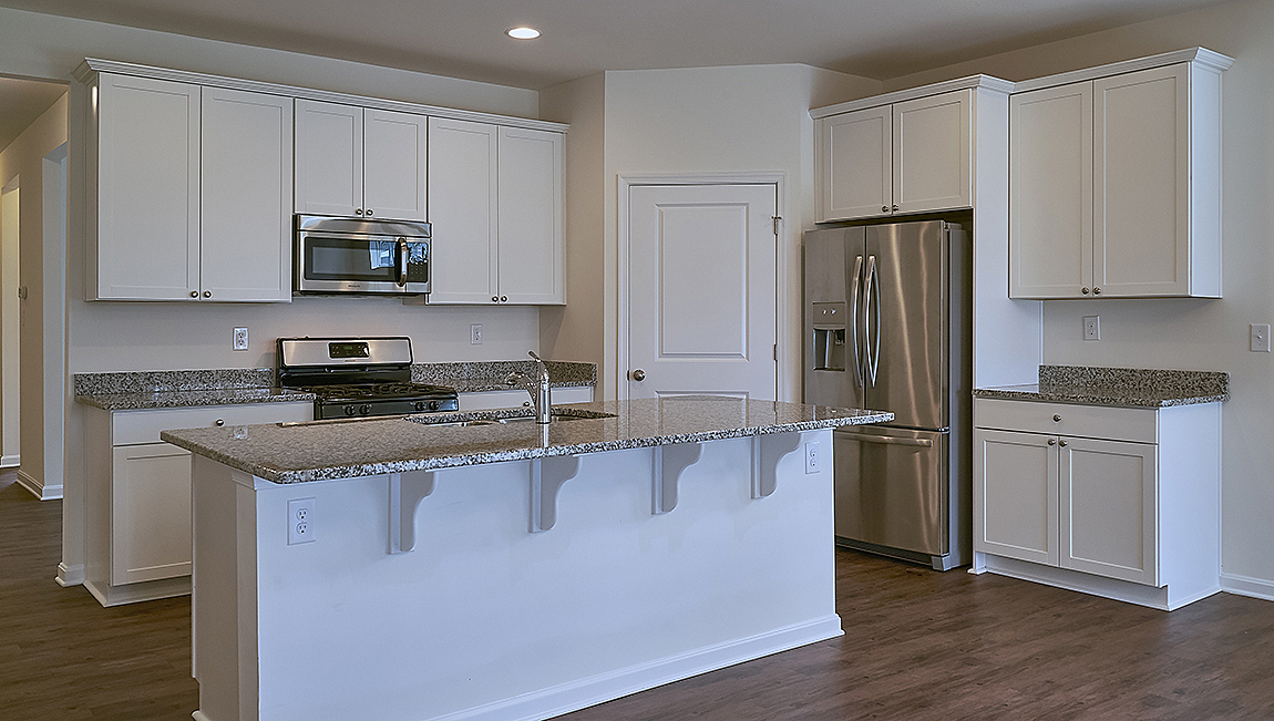 The open kitchen boasts a large island.