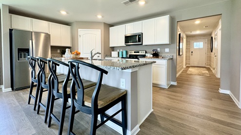 The Neuville's well-appointed kitchen features plenty of cabinetry.