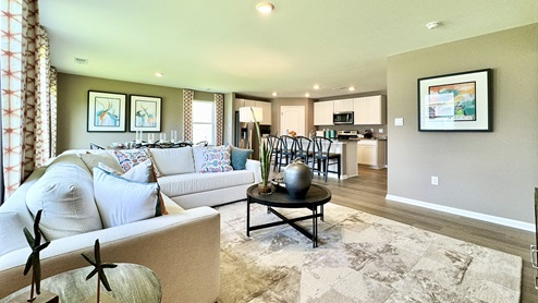 The home's open-concept kitchen, great room and dining area create the ideal space to relax or entertain loved ones.