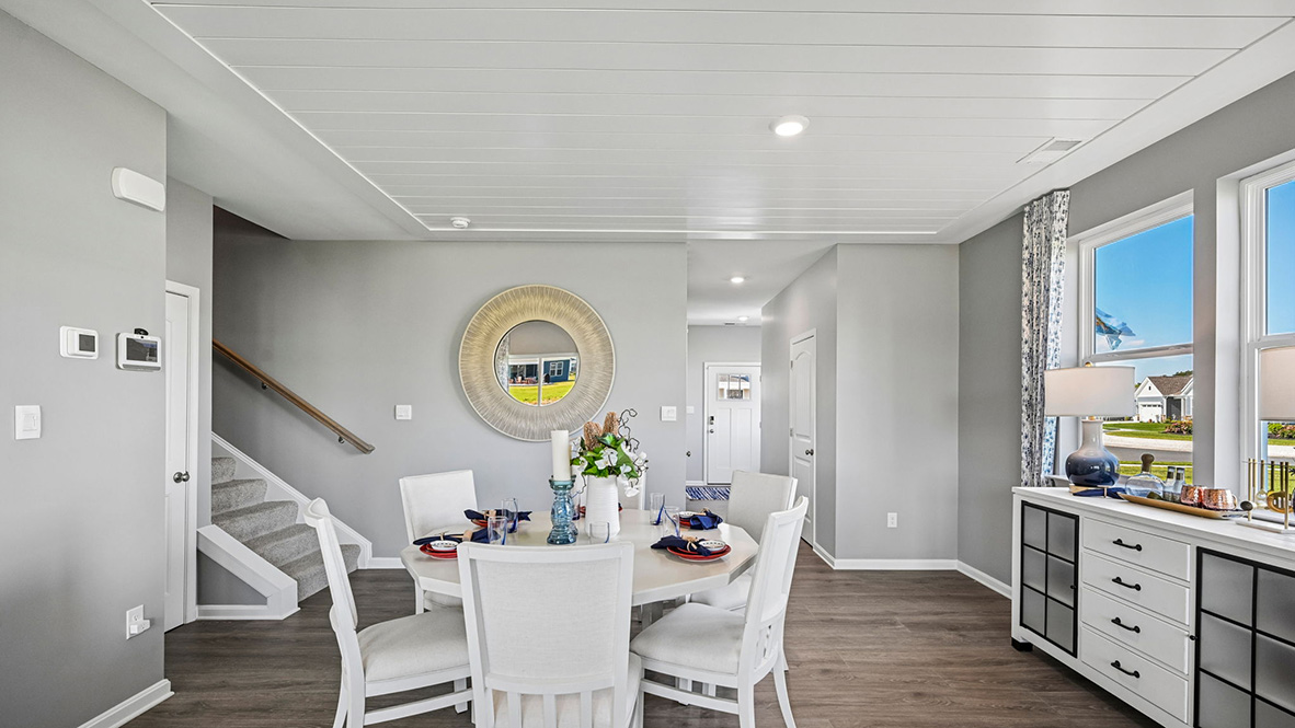 The dining area is open and allows for family and friends to gather comfortably.