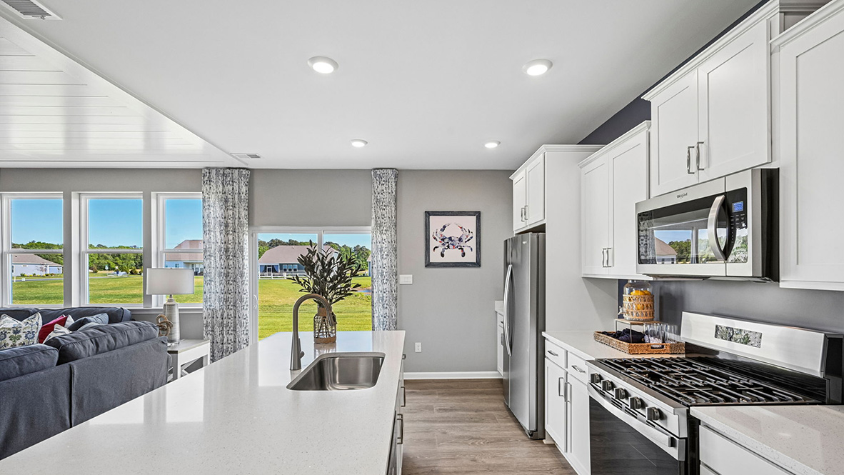 The home's well-appointed kitchen boasts substantial granite or quartz countertops.