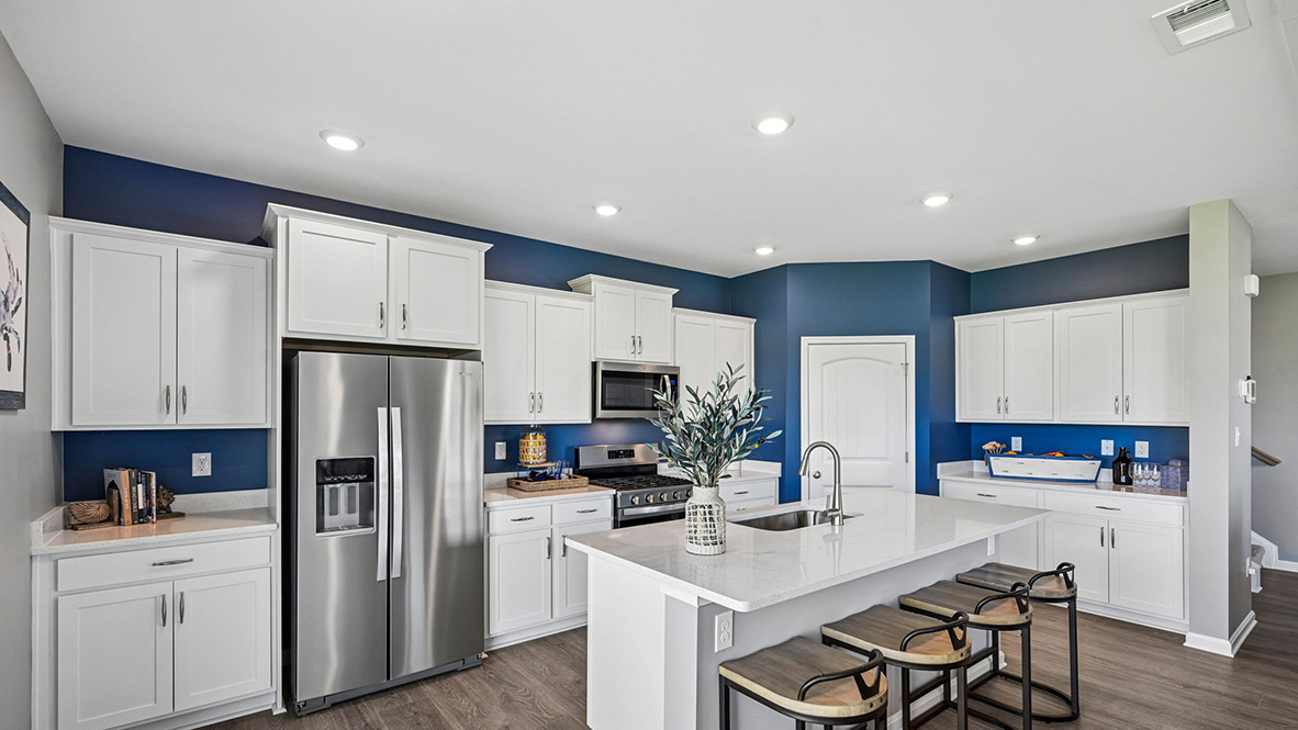 The home's well-appointed kitchen boasts substantial cabinet space.