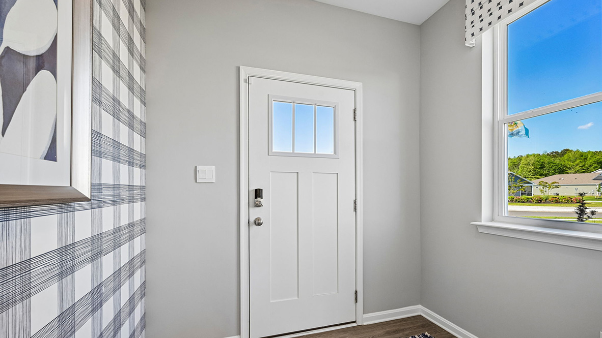 The inviting foyer offers easy access to the upstairs.