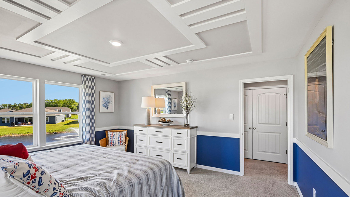 Upstairs, the large owner’s bedroom has a walk-in closet and a modern bathroom.
