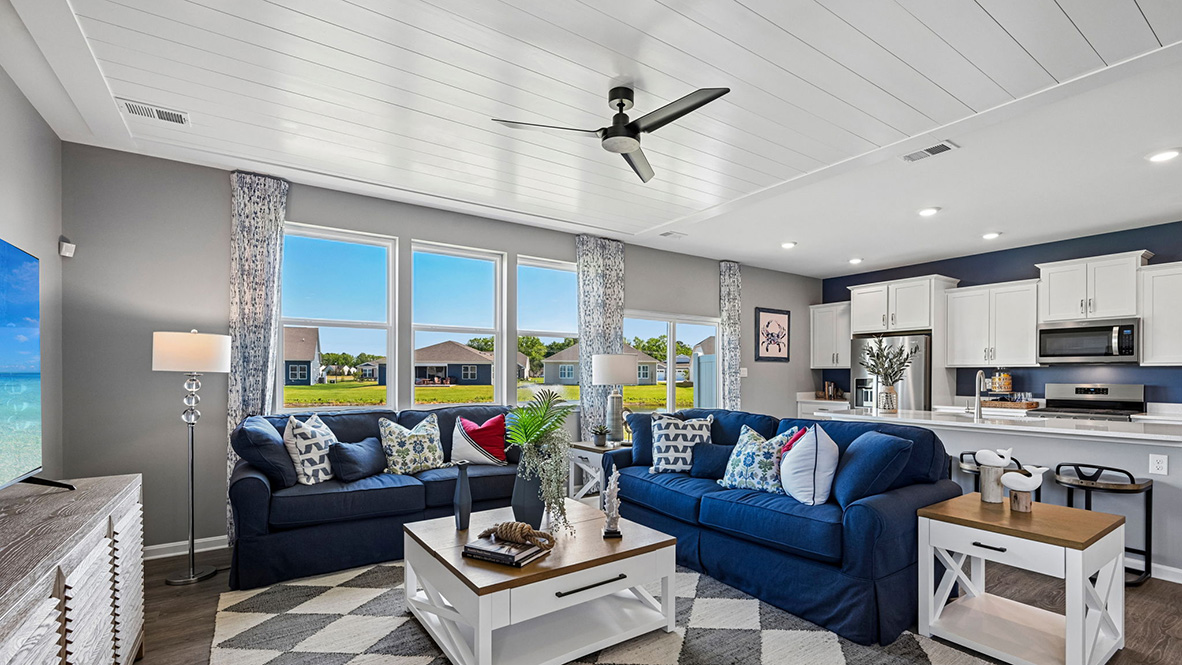 The centered kitchen and expansive great room are all open and allow for family and friends to gather comfortably.