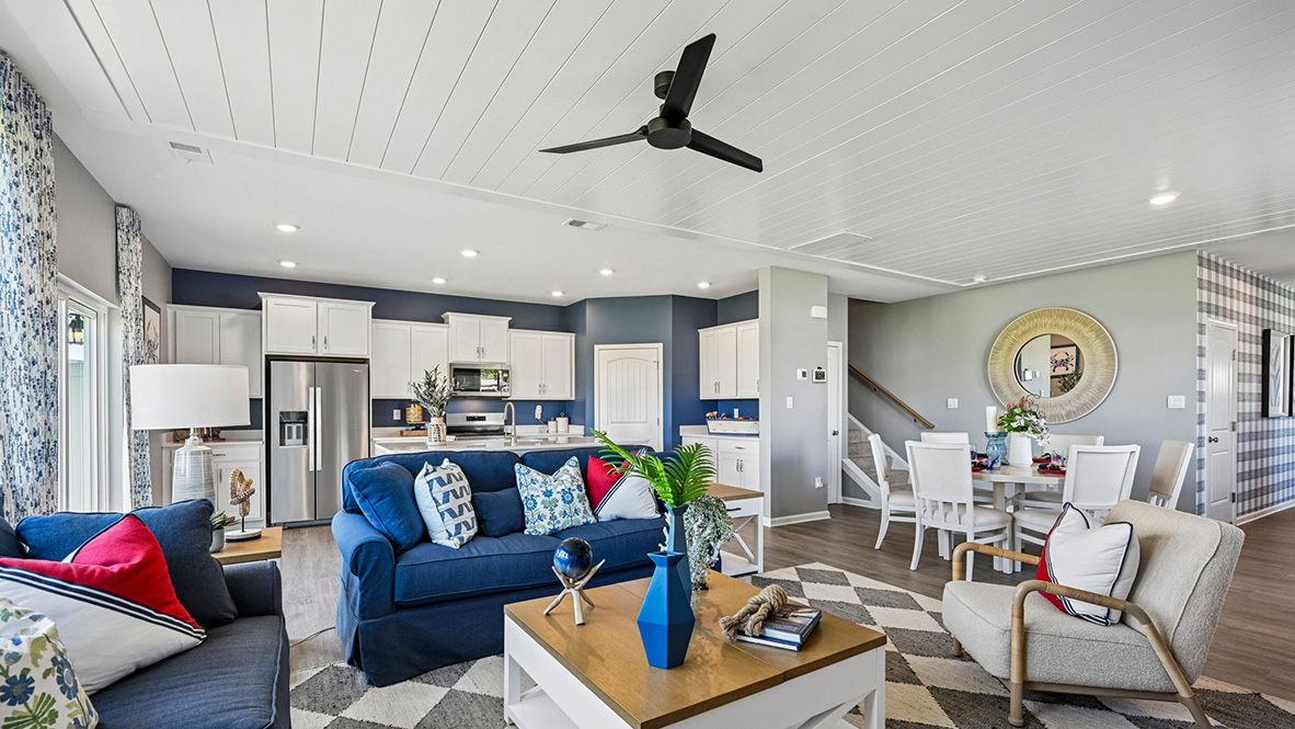 The dining area, centered kitchen, and expansive great room are all open and allow for family and friends to gather comfortably.