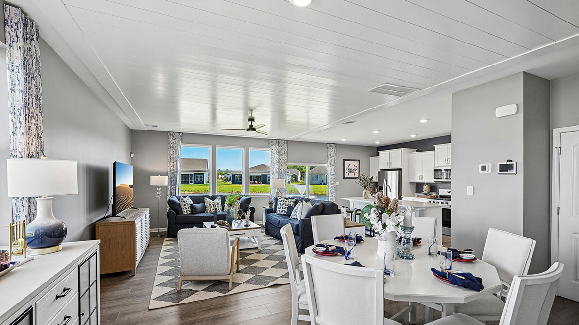 The dining area, centered kitchen, and expansive great room are all open and allow for family and friends to gather comfortably.