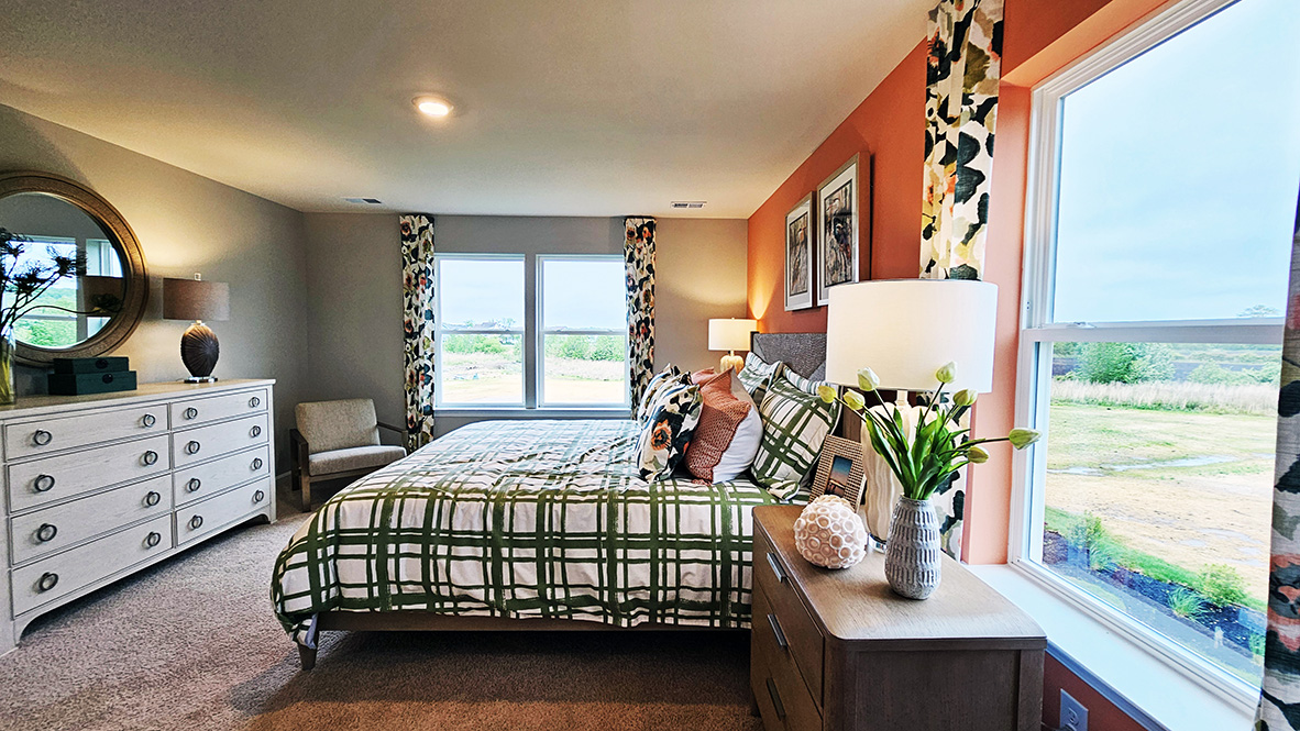 Upstairs, the large owner’s bedroom has a walk-in closet and a modern bathroom.
