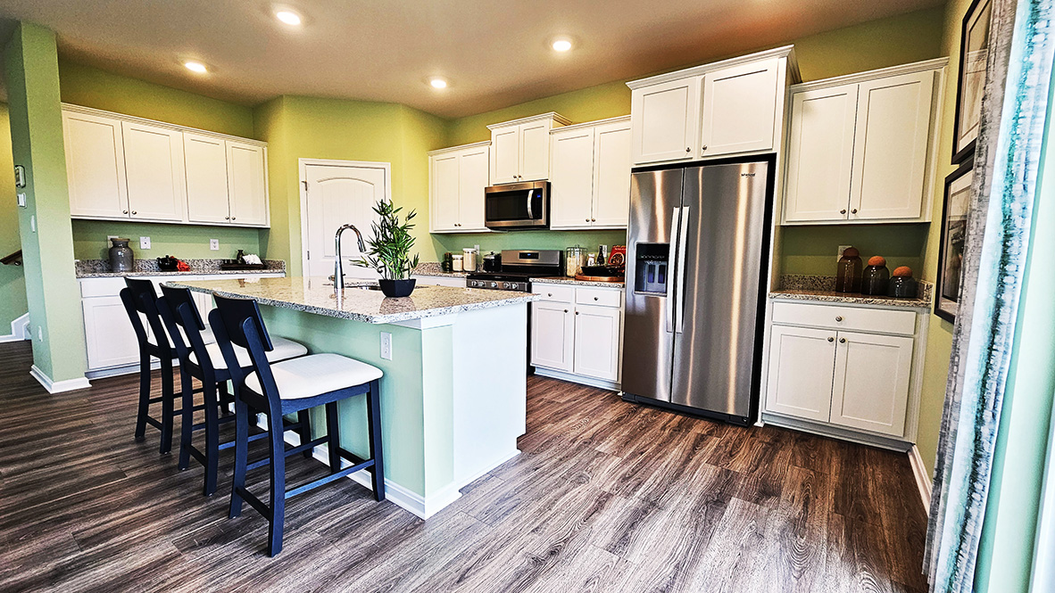The home's well-appointed kitchen boasts substantial cabinet space.