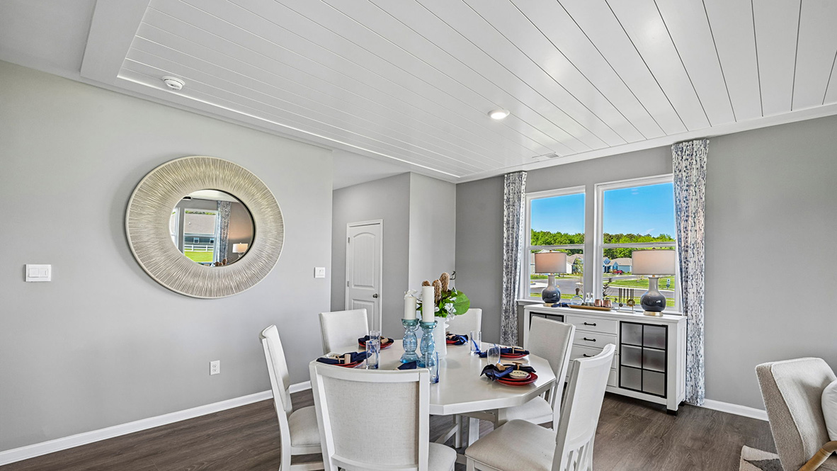 The dining area is open and allows for family and friends to gather comfortably.