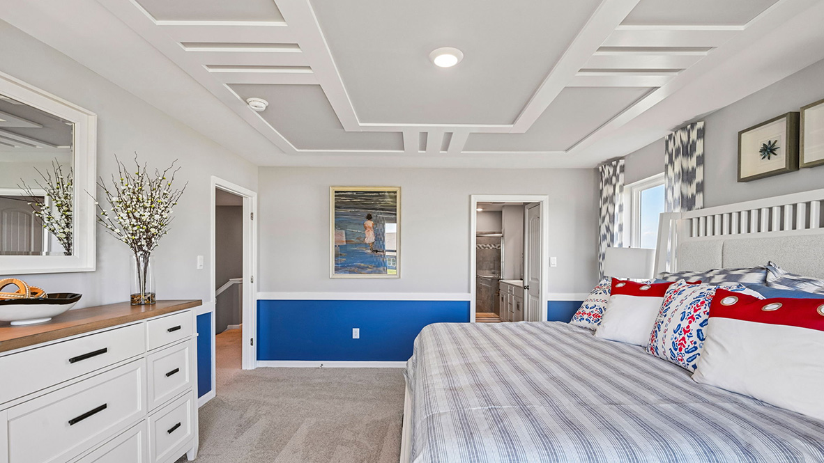 Upstairs, the large owner’s bedroom has a walk-in closet and a modern bathroom.
