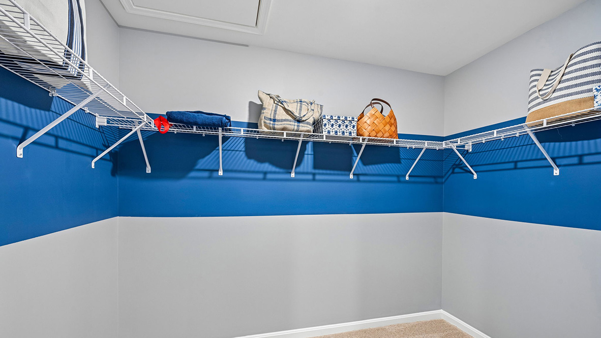 The modern primary bathroom has a double vanity and generously sized shower.