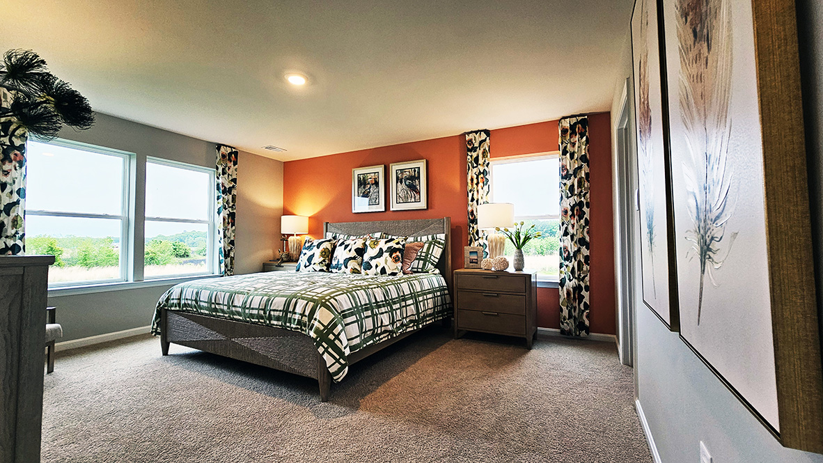 Upstairs, the large owner’s bedroom has a walk-in closet and a modern bathroom.