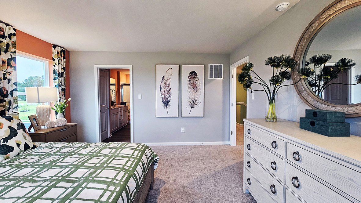 Upstairs, the large owner’s bedroom has a walk-in closet and a modern bathroom.