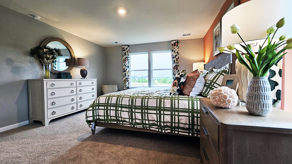 Upstairs, the large owner’s bedroom has a walk-in closet and a modern bathroom.