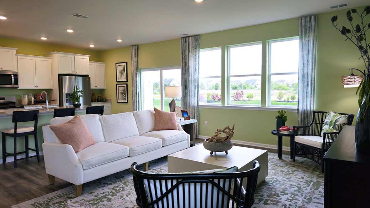 The centered kitchen and expansive great room are all open and allow for family and friends to gather comfortably.