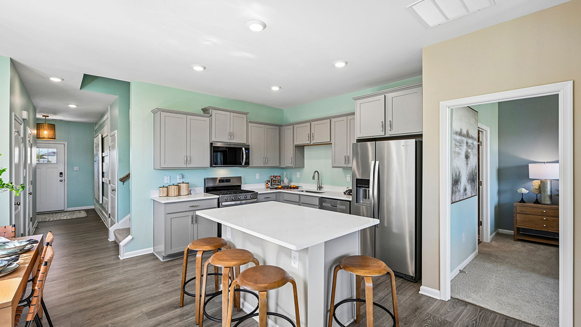 The home’s well-designed eat-in kitchen boasts stainless steel appliances.