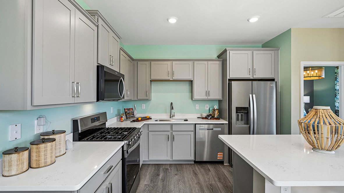 The home’s well-designed eat-in kitchen boasts substantial cabinet space.