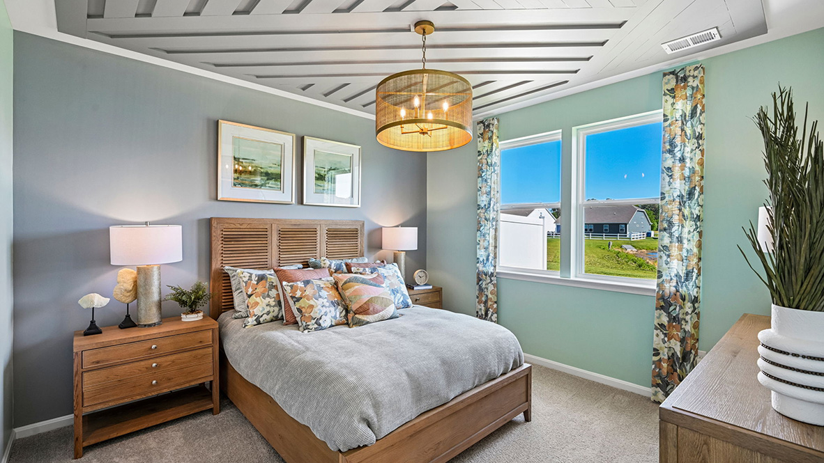 The large first-floor bedroom is a retreat in the back of the home.