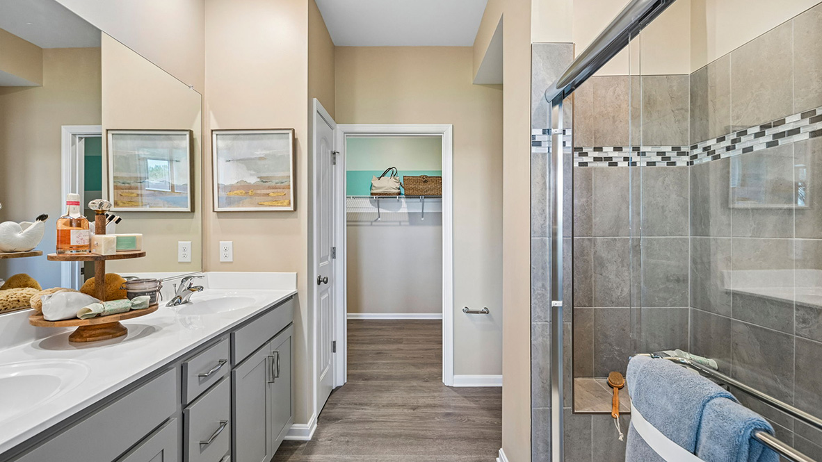 The inviting bathroom has a generously sized shower.