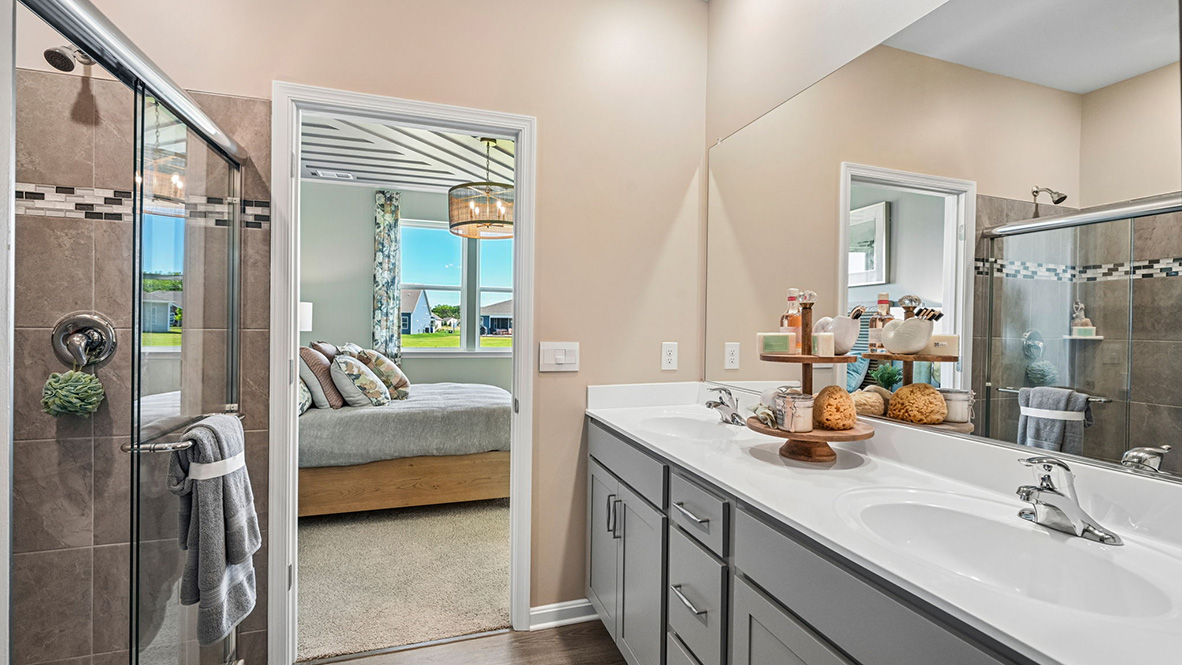 The inviting bathroom has a double bowl vanity.