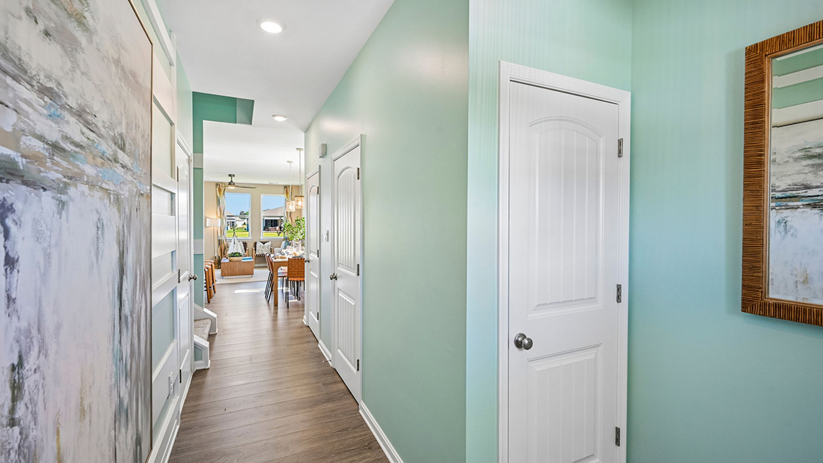 The inviting foyer features a coat closet and access to the conveniently located powder room.