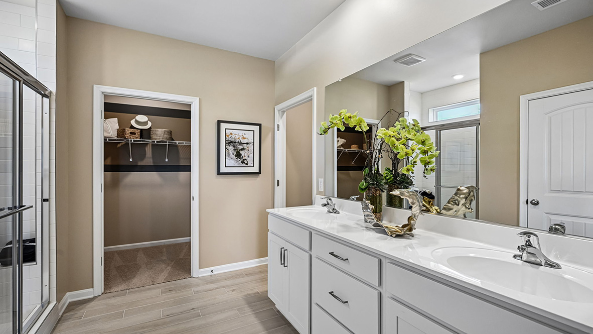 The private bathroom has a double-bowl vanity.